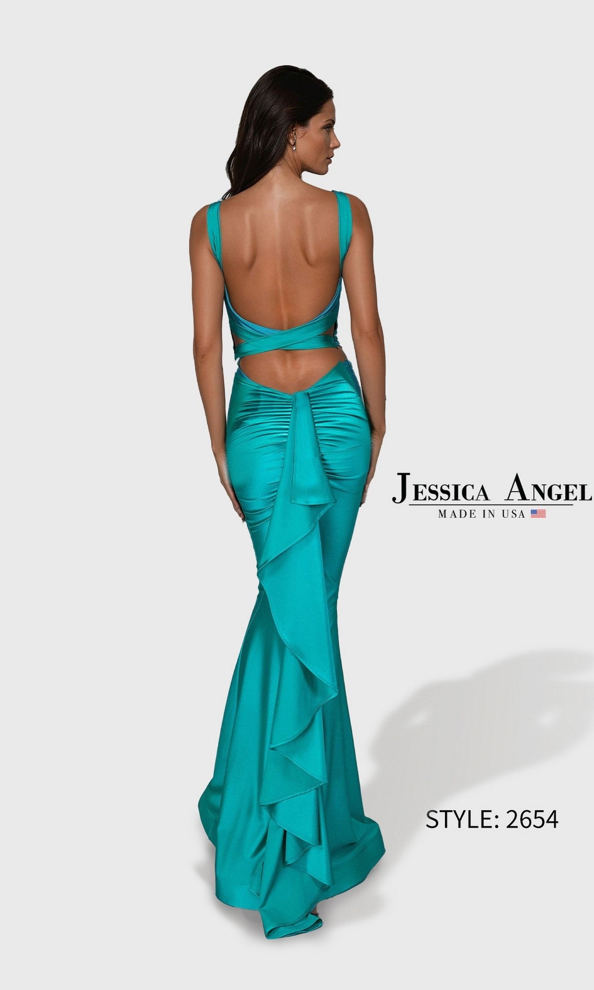A woman poses with her back to the camera in a teal, backless, sleeveless Long Prom Dress: Jessica Angel 2654, featuring ruffle detail. Made in USA from stretch jersey.